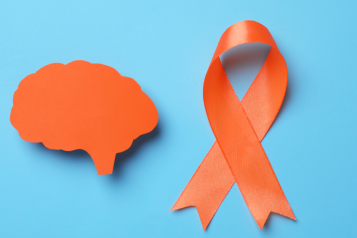 blue background with orange ribbon and a brain
